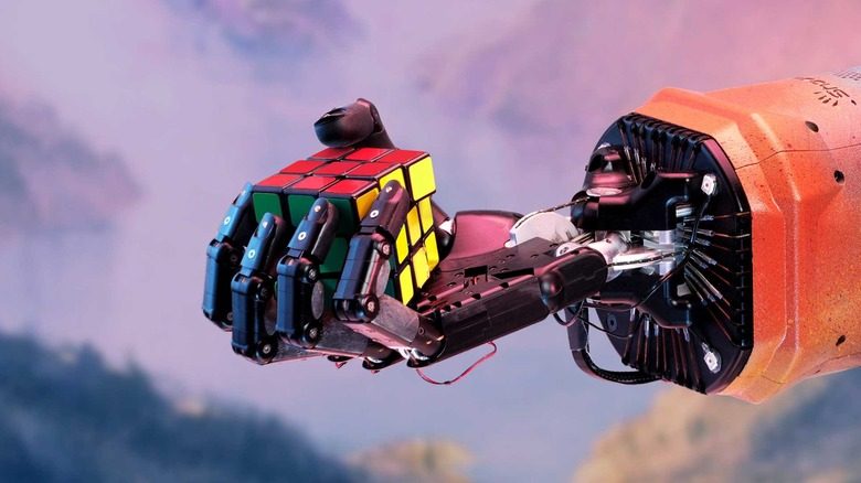 OpenAI's robotic hand holding a Rubik's Cube.