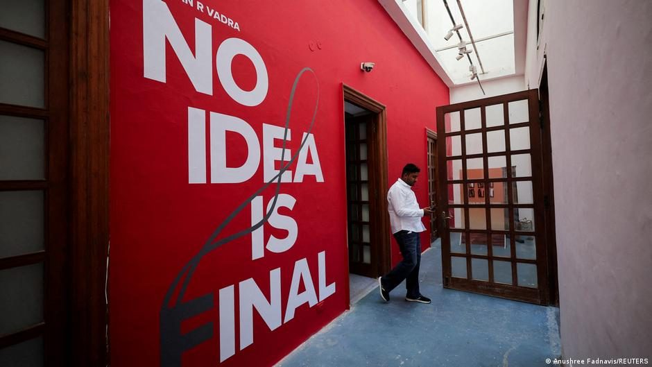 A journalist takes pictures inside the gallery space at Bikaner House, where photographs taken by Raihan Vadra, nephew of Indian opposition leader Rahul Gandhi and son of Indian National Congress (INC