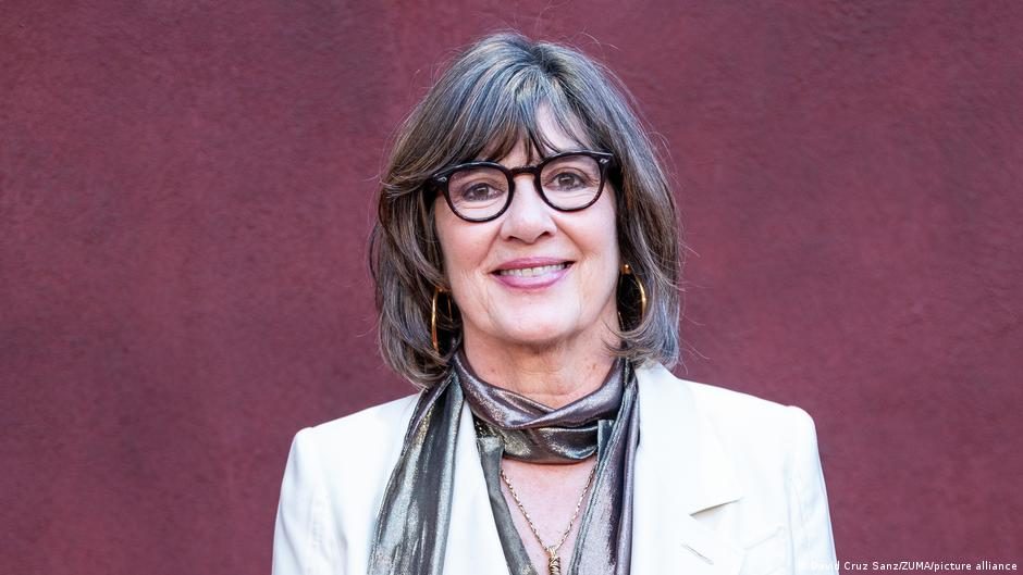 File image: Veteran CNN correspondent Christiane Amanpour (R) makes a live broadcast while surrounded by reporters taking notes, after she managed to scoop the press pool and gain access to Saddam Hus