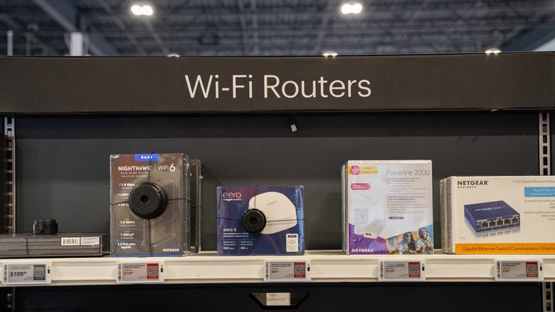 Multiple Wi-Fi router brands on sale in a store.