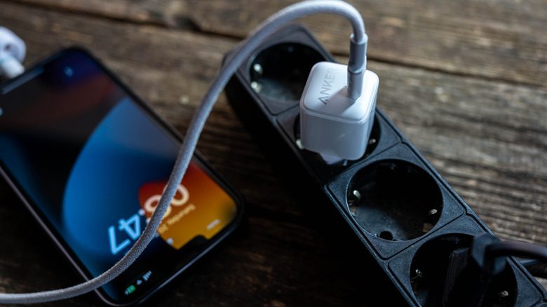 Anker charger connected to an iPhone.