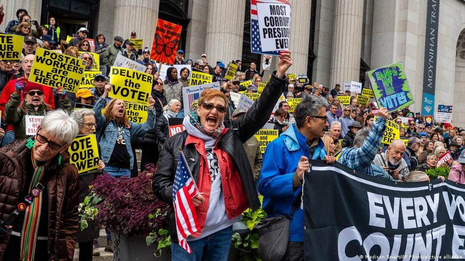 People gather near the Lincoln Memorial during a "No Kings" protest as part of a nationwide day of action aimed at encouraging early voting ahead of the midterm elections, in Washington, DC, US, Octob