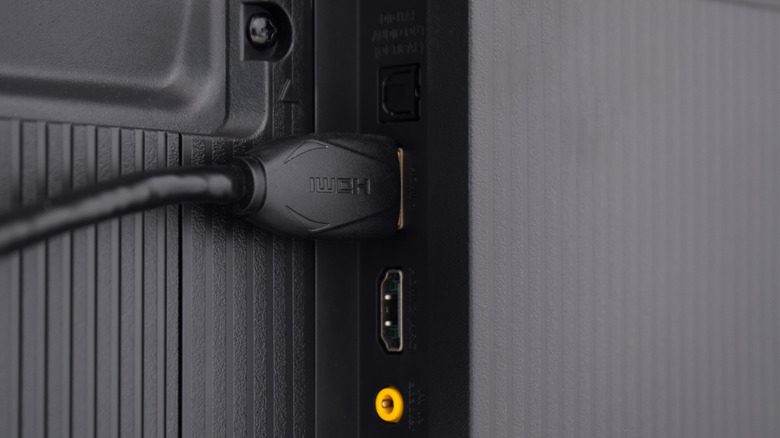 Photo of an HDMI cable plugged into back of a TV.