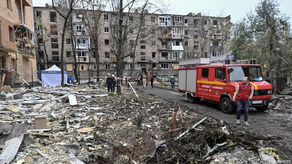 Ukrainian rescuers work outside residential buildings damaged following a Russian missile attack in Zaporizhzhia